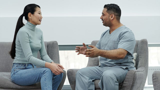 An Intentional Advocate consulting with her patient's doctor on their behalf.