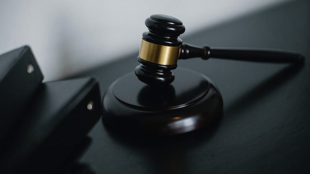 A gavel sitting on a table.